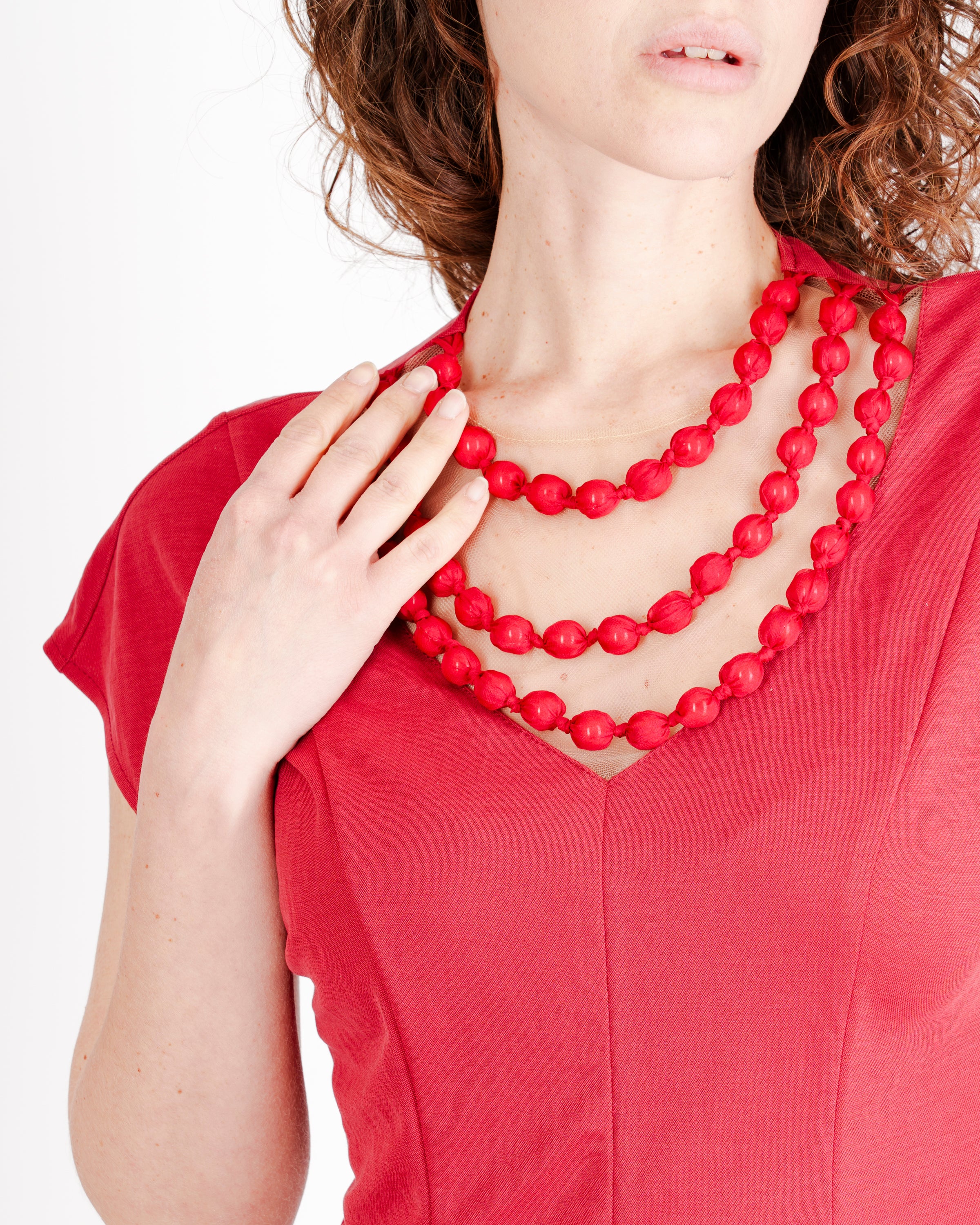 Maglia Edas con perle in tessuto JUNTO